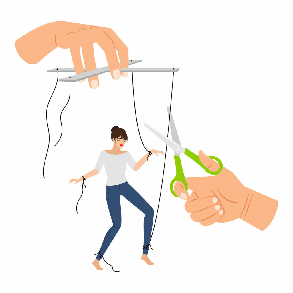 A cartoon of two hands cutting the strings of a marionette. Representing cutting ties with your trauma bond. To get started, call today for trauma therapy in Charlotte, NC. 